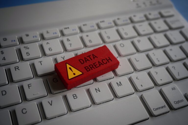 a block saying data breach on a computer keyboard