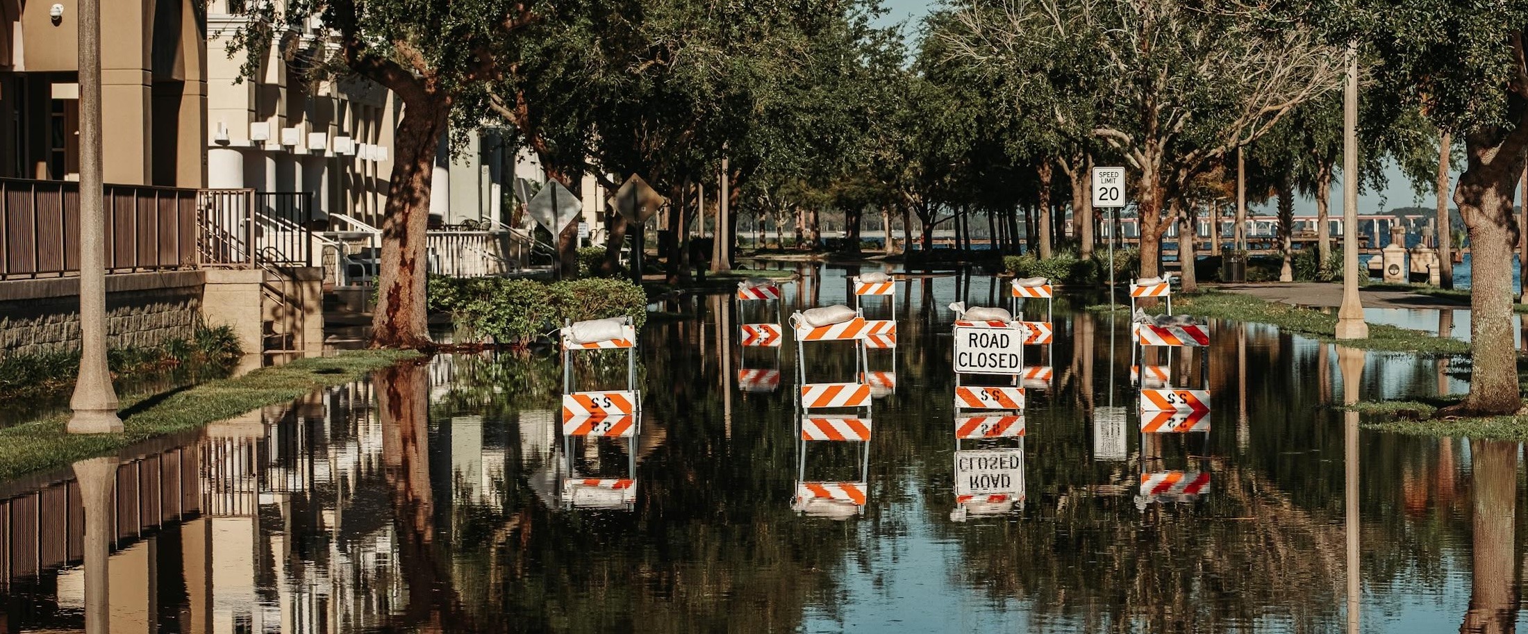 flooded street with closed sign